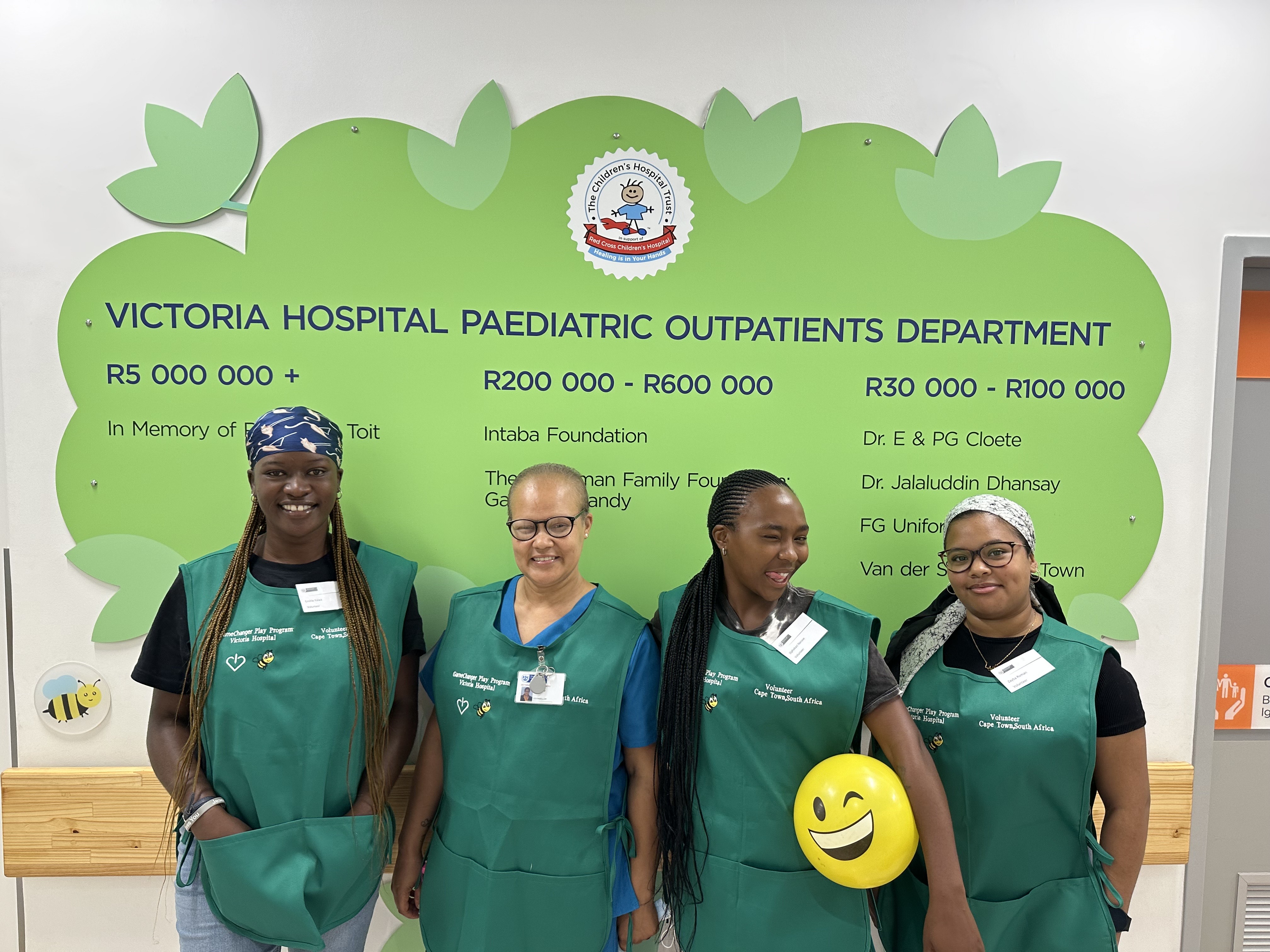 GameChanger volunteers in branded aprons at a Cape Town children's hospital.